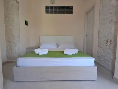 Letto o letti in una camera di Casa Perry