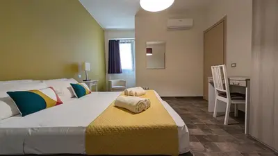 Letto o letti in una camera di Casa Cindy
