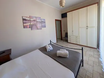 Letto o letti in una camera di Carmenlory home