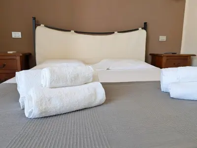 Letto o letti in una camera di Carmenlory home