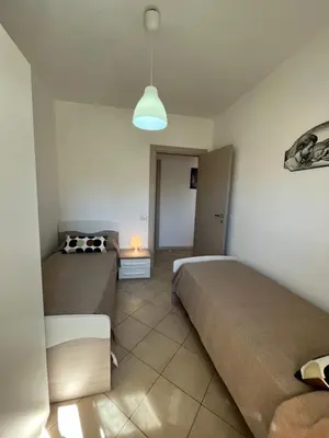 Letto o letti in una camera di Marzamemivacanze