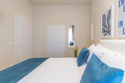Letto o letti in una camera di Appartamenti Santo Spirito by Made in Ortigia Apartments