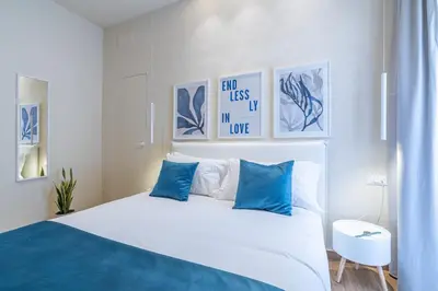 Letto o letti in una camera di Appartamenti Santo Spirito by Made in Ortigia Apartments