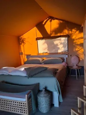 Letto o letti in una camera di Oasi conca d'oro glamping