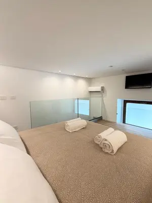 Letto o letti in una camera di Ortigia elegant loft