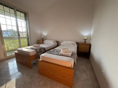 Letto o letti in una camera di Apartment in a villa with a relaxing pool