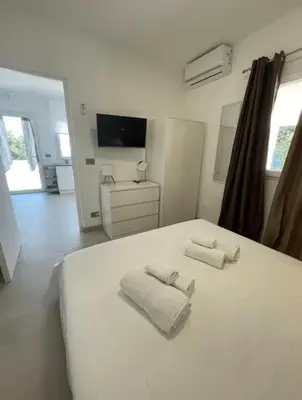 Letto o letti in una camera di Casa delle Antille vista mare