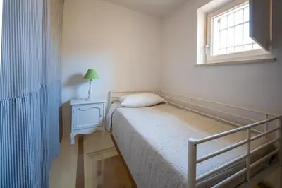 Letto o letti in una camera di Casa Sciuretta