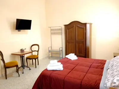 Letto o letti in una camera di Bred breakfast D&D