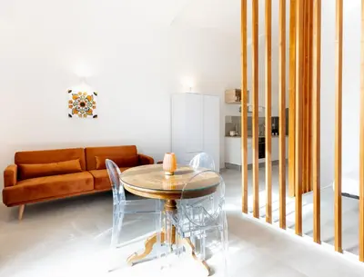 Area soggiorno di Pindaro House by Ortigia Apartments