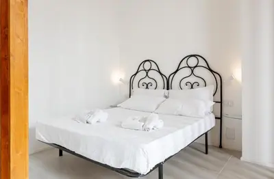 Letto o letti in una camera di Pindaro House by Ortigia Apartments