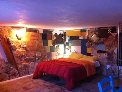 Letto o letti in una camera di Apartment Giniusa' Studio mit Whirlpool-Badewanne by Interhome