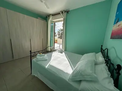 Letto o letti in una camera di Kitiya's House- Di fronte la spiaggia e un mare cristallino