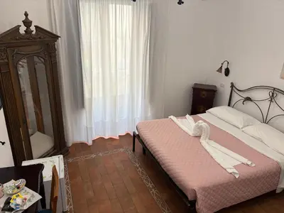 Letto o letti in una camera di B&B Mirabella Rooms Ortigia