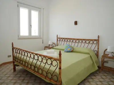 Letto o letti in una camera di Villa Carmela