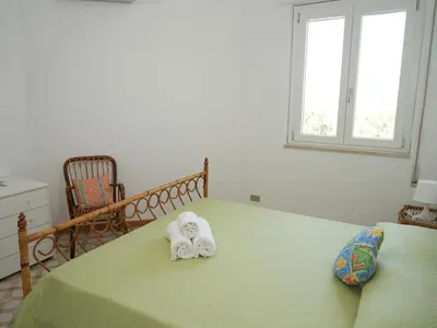 Letto o letti in una camera di Villa Carmela