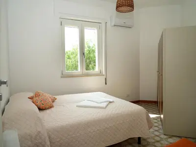 Letto o letti in una camera di Villa Carmela