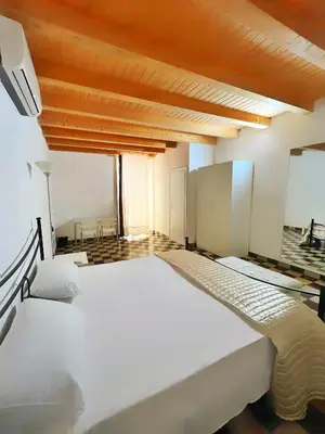 Letto o letti in una camera di Pantalica Rooms Affittacamere Sortino Siracusa