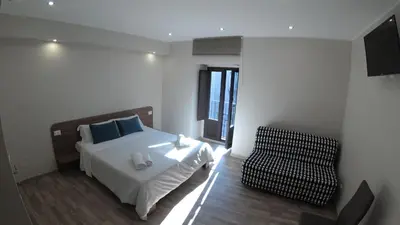 Letto o letti in una camera di Tre Stelle al Duomo