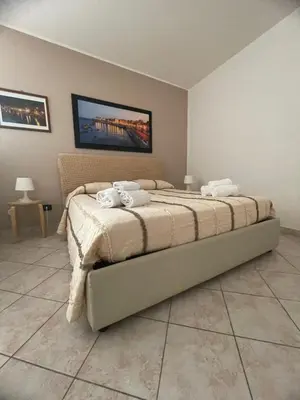 Letto o letti in una camera di Lungomare Elio Vittorini