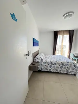 Letto o letti in una camera di B&B Le Maree
