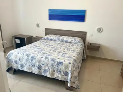Letto o letti in una camera di B&B Le Maree
