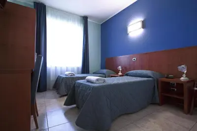 Letto o letti in una camera di Hotel San Martino
