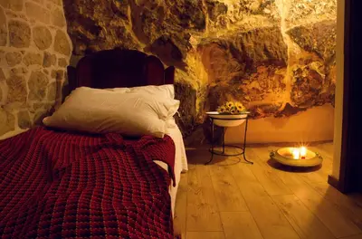 Letto o letti in una camera di Si-Moutique, le Case-grotte degli Avi 2