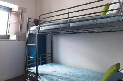 Letto o letti in una camera di Family apt by Dimore in Sicily