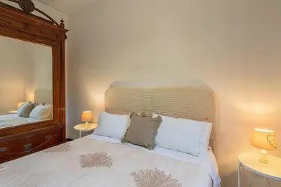 Letto o letti in una camera di Villa Melisa
