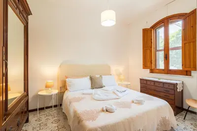 Letto o letti in una camera di Villa Melisa