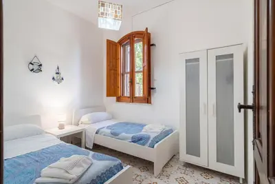 Letto o letti in una camera di Villa Melisa