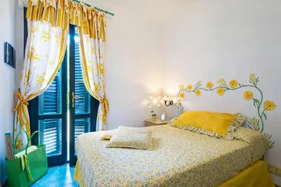 Letto o letti in una camera di Case di Fiori Beachfront villa with terrace and direct beach access