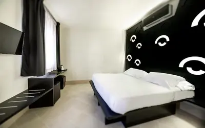 Letto o letti in una camera di Addauro Resort