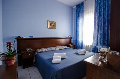 Letto o letti in una camera di Miramare Hotel