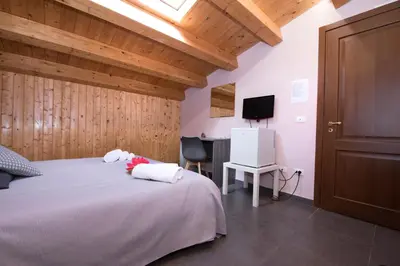 Letto o letti in una camera di Casa Malaclà B&B