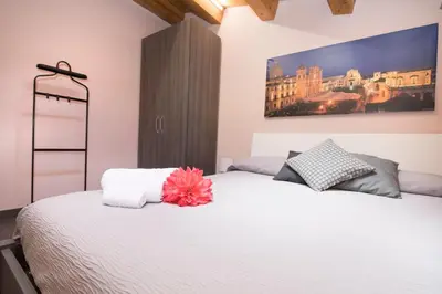 Letto o letti in una camera di Casa Malaclà B&B