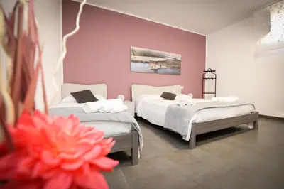 Letto o letti in una camera di Casa Malaclà B&B