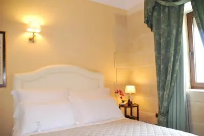 Letto o letti in una camera di Domus Mariae Benessere