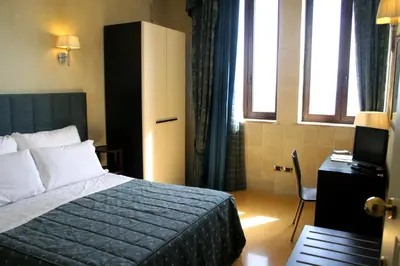 Letto o letti in una camera di Domus Mariae Benessere