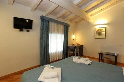 Letto o letti in una camera di Rigel Hotel