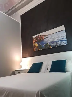 Letto o letti in una camera di B&B I Puritani