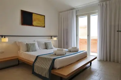 Letto o letti in una camera di Castello Tafuri