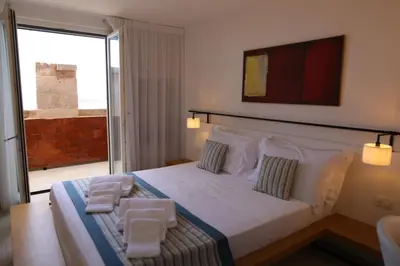 Letto o letti in una camera di Castello Tafuri