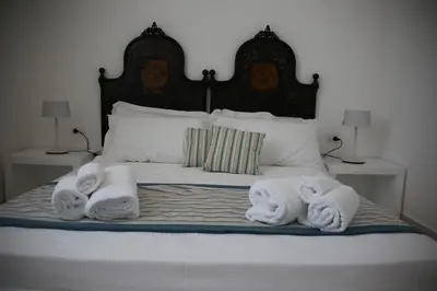 Letto o letti in una camera di Castello Tafuri