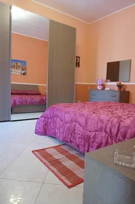 Letto o letti in una camera di Casa Vacanza il Ciliegio
