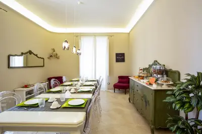 Area soggiorno di Maecò Ortigia B&B - Deluxe Rooms & Suites