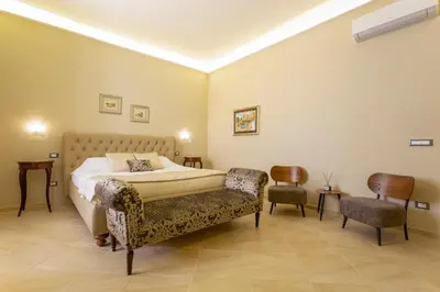 Letto o letti in una camera di Maecò Ortigia B&B - Deluxe Rooms & Suites