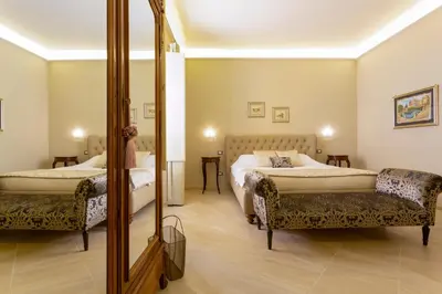 Letto o letti in una camera di Maecò Ortigia B&B - Deluxe Rooms & Suites