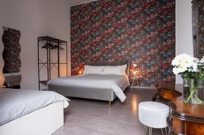 Letto o letti in una camera di Duomo & University Rooms Catania Center